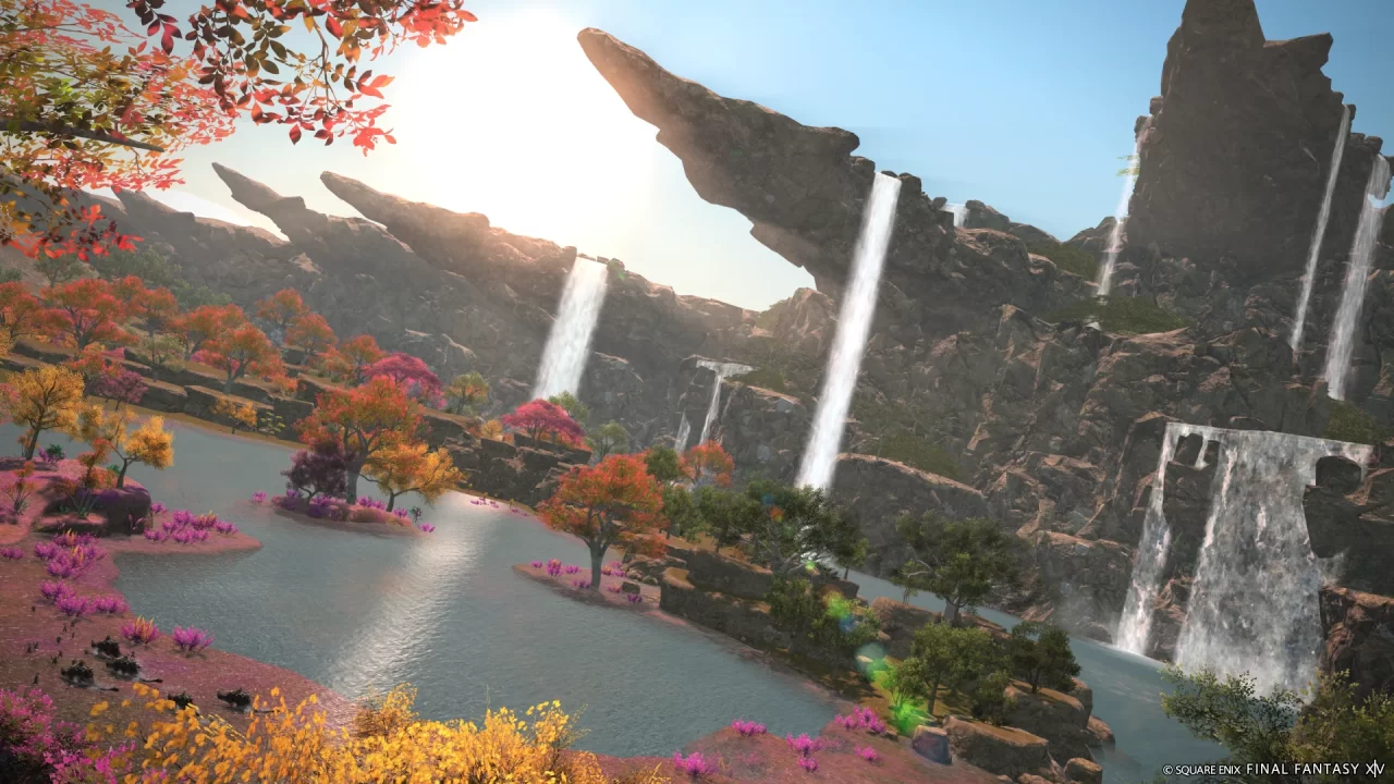 Final Fantasy XIV: Dawntrail screenshot of a beautiful vista with jutting mountains and waterfalls.